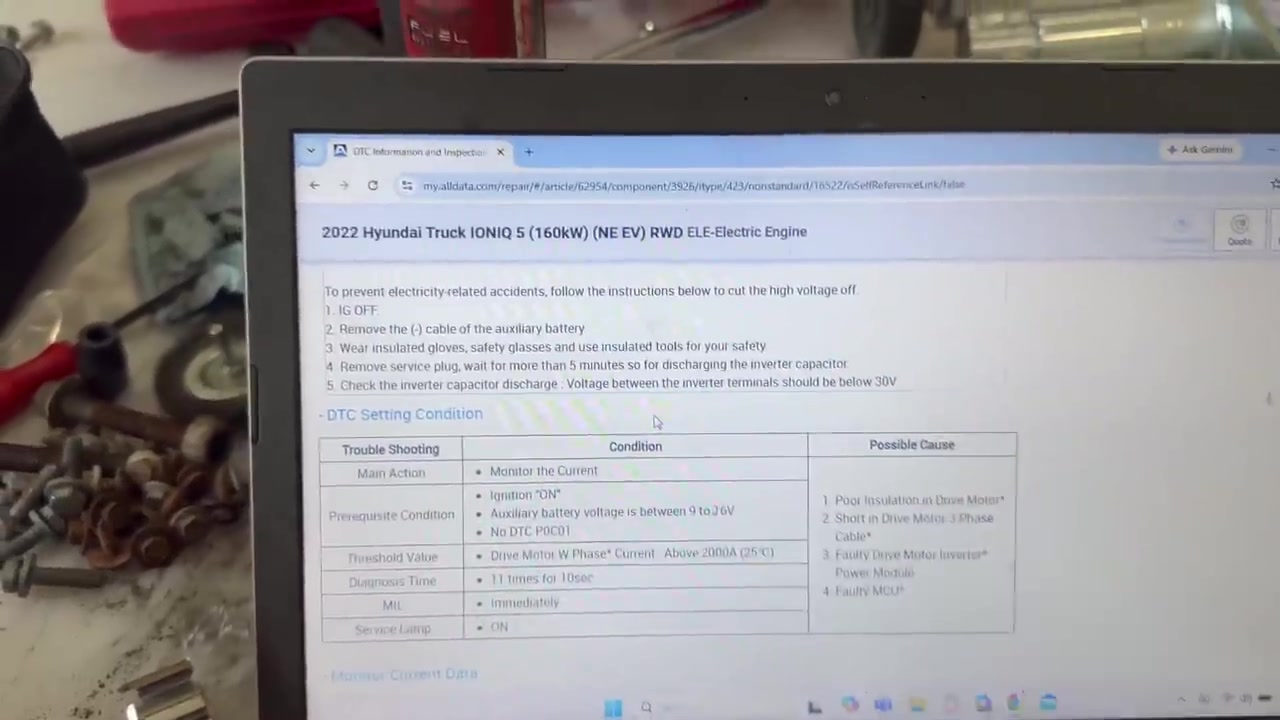 AllData laptop showing IONIQ 5 W-phase current above 2000A and listed causes