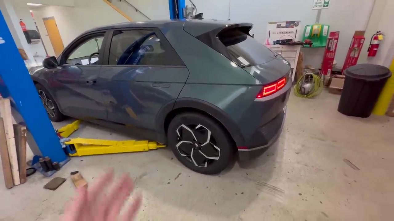 2022 Hyundai IONIQ 5 on the shop floor between a two-post lift