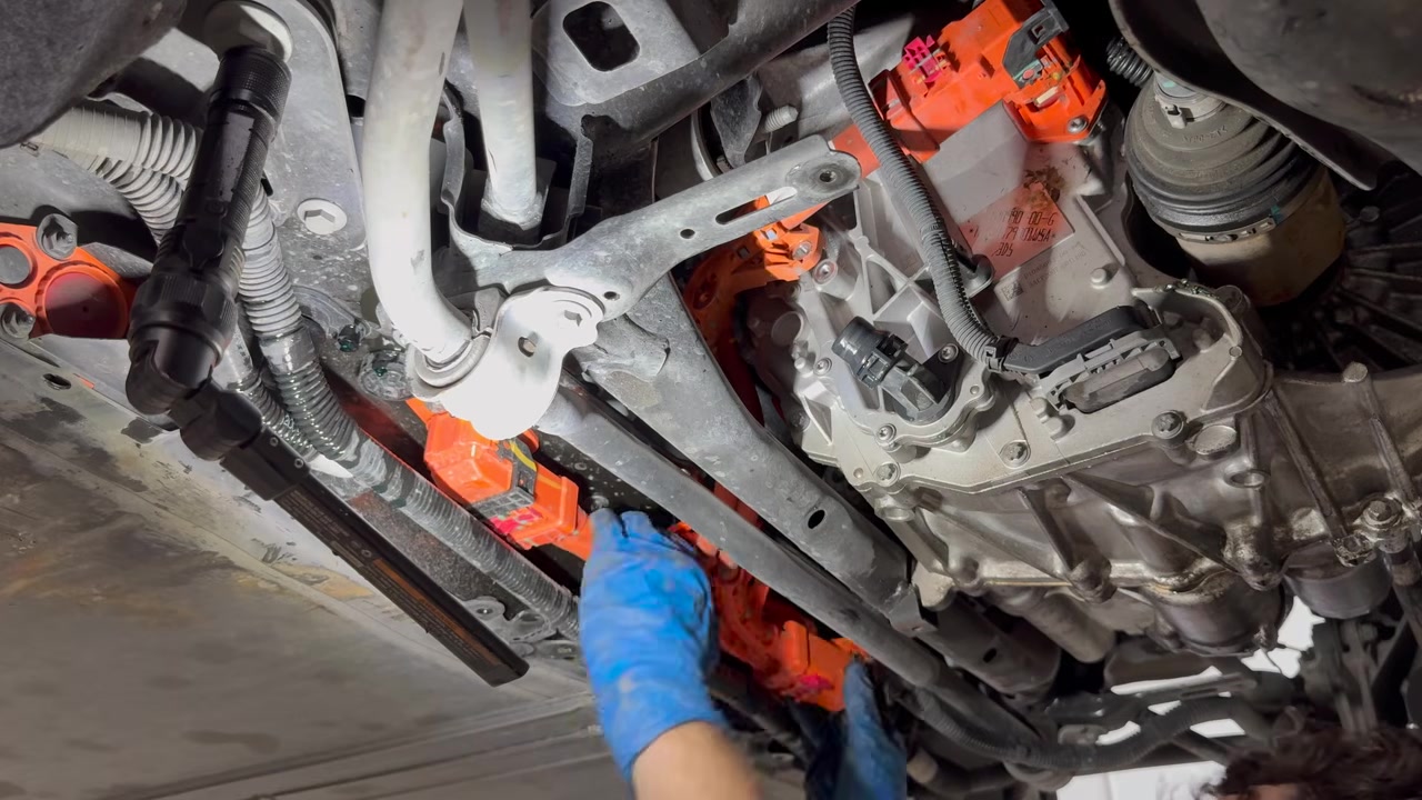 Unplugging the HV cable at the inverter on a Model Y rear drive unit