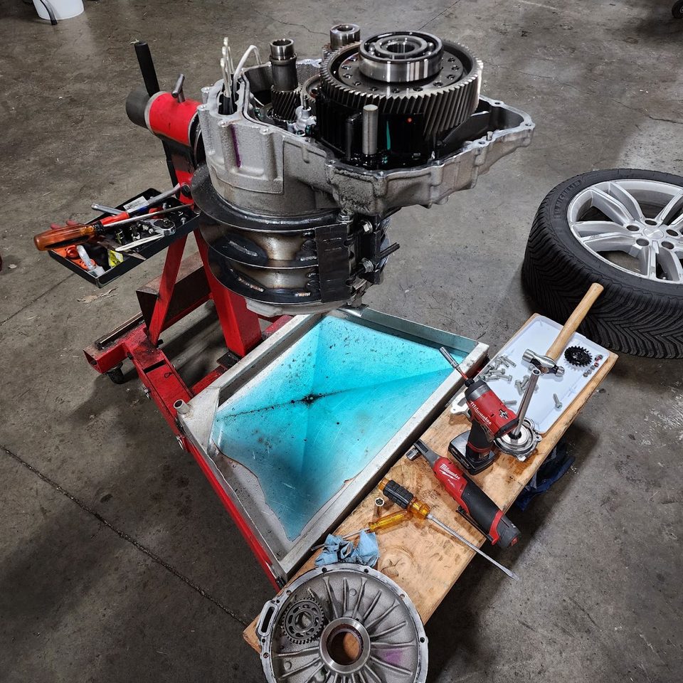EV drive unit opened on a stand in the shop
